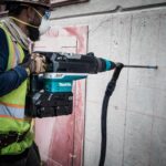 Makita GRH06PM Action Shot 1 (drilling with dust extraction bit)